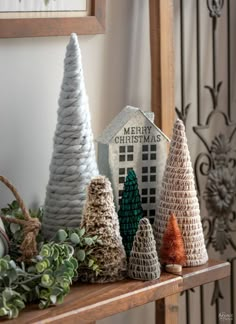 christmas decorations are displayed on a mantle in the living room