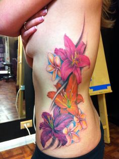 a woman's stomach with flowers on it