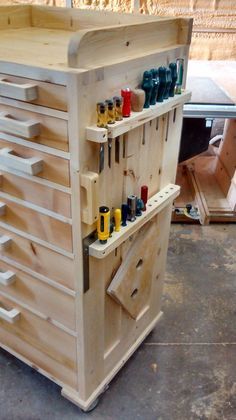 a wooden workbench with many tools on it