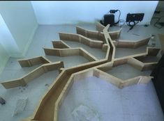 an unfinished skateboard ramp in the middle of a room