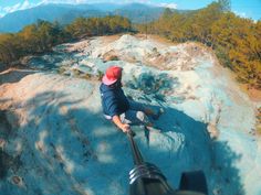 a man riding a skateboard down the side of a mountain