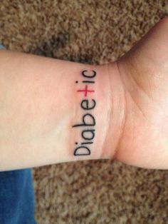 a person with a cross tattoo on their wrist that says dopet and jesus