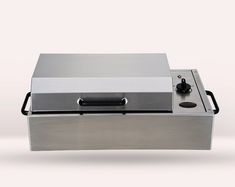 a stainless steel box with a black handle on the lid and an electronic device attached to it