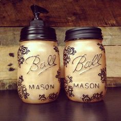 two mason jars sitting on top of a table next to each other with the words ball mason written on them