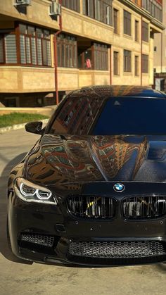 a black car parked in front of a building