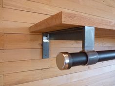 a wooden wall with metal brackets on it