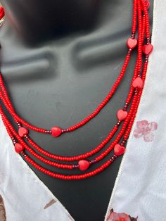 "This beautiful necklace is composed of true red seed beads that surround pretty acrylic hearts  surrounded by faceted glass beads and set asymmetrically among four strands. It is a beautiful piece to add to any outfit and ideal for Valentine's Day. Sterling silver clasp and findings.  Necklace measures approximately 19 3/4\" at shortest strand." Cheap Heart-shaped Beaded Necklaces For Valentine's Day, Affordable Heart-shaped Beaded Necklaces For Valentine's Day, Valentines Day Necklace, Floating Heart Necklace, Red Beaded Necklace, Red Crystal Necklace, Briolette Necklace, Red Heart Necklace, Red Beaded Necklaces