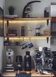 an espresso machine sitting on top of a wooden counter