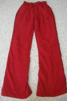 Youth Nike sweat pants red color, 2 front pockets, jersey lined, elastic/drawstring waist Tag Size: L 40% cotton/60% polyester Measurements: 11" waist across (before stretched) 30" inseam  10.5" rise Great condition   U.S. shipping only. Will be mailed within 24hrs of cleared payment.   Thank you and have a great day! Pants Inspiration, Champagne Earrings, Red Jersey, Nike Sweats, Nike Jersey, Nike Red, Sweat Pants, Color 2, Nike Pants