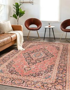 two chairs and a rug in a living room