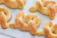 freshly baked pretzels on a baking sheet ready to be baked into the oven