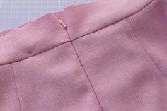 a piece of pink fabric is being sewn together