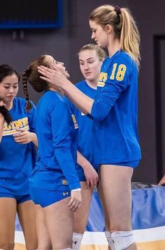 the volleyball team is congratulating each other