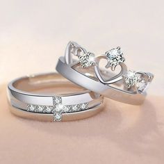 two wedding rings with diamonds on them