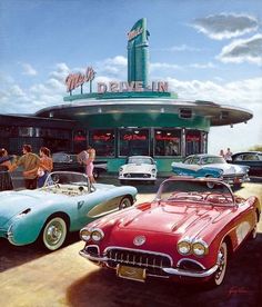 several classic cars parked in front of a diner