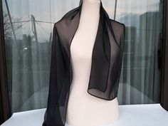 **The transparent scarf is made from 100% silk chiffon  fabric. This silk scarf is elegant and graceful, which goes well with any formal dresses. Black colors create a lovely picture for you to wear with your favorite outfit. Dimensions * Silk  Mousseline Scarf Length 136 cm Width 30 cm * Silk square Scarf Length 50cm  Width  49 cm  Wash gently in cold water. It's a wonderful gift choice for everyone. Ready to ship. Thank you for visiting my shop. Elegant Silk Scarf For Spring Party, Elegant Sheer Silk Scarves, Elegant Sheer Silk Scarf For Formal Occasions, Black Silk Scarf For Party, Elegant Black Silk Scarf For Spring, Elegant Silk Chiffon Scarves For Wedding, Formal Solid Color Chiffon Silk Scarf, Elegant Organza Scarves For Party, Elegant Black Silk Scarf For Party