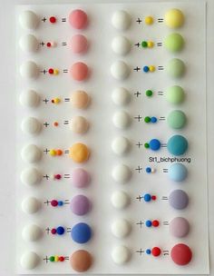 an array of different colored balls on a white surface with the numbers 1, 2, 3 and 4