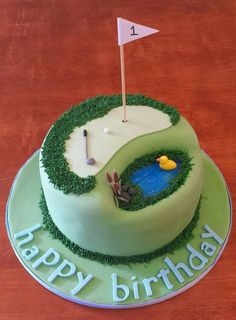 a green birthday cake with a golf hole and flag on the top that says happy birthday