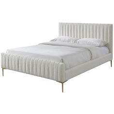 the bed is made with white linens and wooden legs, but no headboard