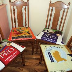 four wooden chairs with various books on them