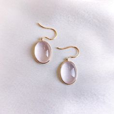 These stunning earrings are set in 14k Solid Yellow Gold with Natural Rose Quartz with utmost precision. It is an unique gemstone earring pair for nearly every occasion and is completely hassle-free jewelry. 🔷ABOUT GEMSTONE:  Rose quartz is often called the "Stone of Love" and is believed to promote all forms of love, including self-love, romantic love, and love for others. It can help individuals open their hearts to love and develop a greater sense of compassion and empathy. Rose quartz is of Handmade Jewelry Box, Bezel Earrings, Rose Gold Quartz, Rose Quartz Earrings, Birthstone Earrings, Earrings Christmas, January Birthstone, Birthstone Earring, Unique Gemstones