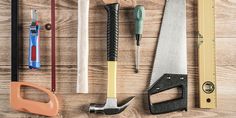 various tools laid out on a wooden surface