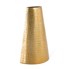 a gold vase sitting on top of a white table