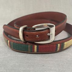 This vintage belt is a must-have for any Western enthusiast. The brown leather and multicolor fabric weave insert adds a touch of Western flare to any outfit. With a size of 48 and a width of 1 1/4", this belt is perfect for men who want to add a touch of style to their wardrobe. Made of high-quality leather, this belt is durable and will withstand the test of time. This is a vintage pre-owned item that may have small imperfections due to its age. Please review the photos carefully before purchasing. Fabric Weave, Western Belt, 2025 Vision, Vintage Belt, Western Belts, Vintage Belts, Louisville Ky, Suspender Belt, Leather Fabric