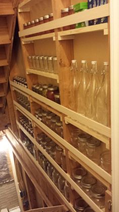 the shelves are filled with bottles and jars