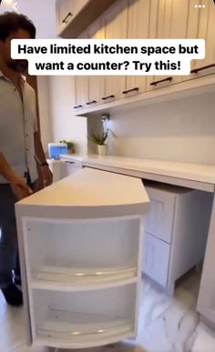 two people standing in a kitchen next to an open refrigerator freezer with the words have limited kitchen space but want a counter? try this