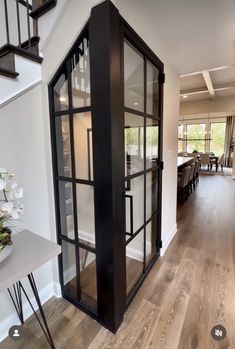 the interior of a house with wood floors and glass doors