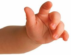 a baby's hand is holding the finger of someones hand, against a white background