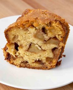 a close up of a muffin on a plate with a bite taken out of it