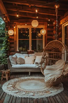 the porch is decorated with lights and wicker furniture