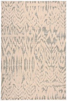 a beige and grey rug with an abstract design on the bottom, in front of a white background