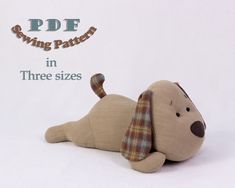 a stuffed dog laying on its side with the caption pdde sewing pattern in three sizes