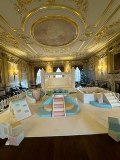 an elaborately decorated room with white and blue furniture