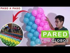 a man is holding balloons in front of a sign that says pared con globos