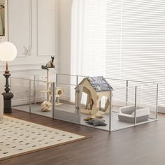 a living room filled with furniture and a cat house on top of a wooden floor