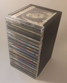 a stack of cds sitting on top of each other