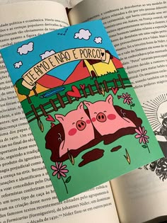 an open book with two pigs on the cover and another pig in the background reading le petito no fopco