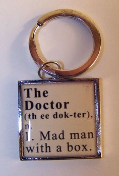 a keychain that has the words doctor and mad man with a box on it