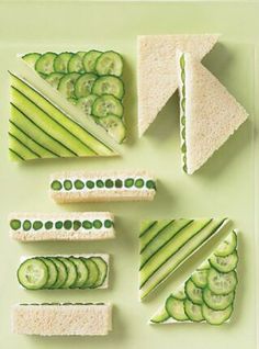 cucumber and cheese sandwiches arranged on a plate