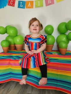 Fun and Festive Serape Dress for Kids! 💗 How fun is this Serape Dress? If you love all things Serape like I do, you’ll adore this stylish piece! ❤️ Each dress features vibrant colors and unique patterns, making every dress one-of-a-kind. Perfect Fit: Available in sizes 1-2T (19" long), 2-3T (20" long), and 4-5T (22" long). Bestseller Alert: This dress is a favorite for good reason! 💥 Stylish Accessories: Complete the look with a matching hand-tied Big Bow Headband! Explore more from our Razels Multicolor Fitted Twirl Dress For Playtime, Multicolor Dress For Cinco De Mayo Fiesta, Playful Fitted Dress For Festive Occasions, Multicolor Twirl Dress For Playtime In Summer, Playful Multicolor Dresses For Playdate, Playful Multicolor Dress For Playdate, Fitted Multicolor Twirl Dress For Playdates, Fun Multicolor Short Sleeve Twirl Dress, Fitted Multicolor Twirl Dress