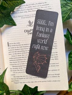 a bookmark that reads start i'm living in a fantasy world right now