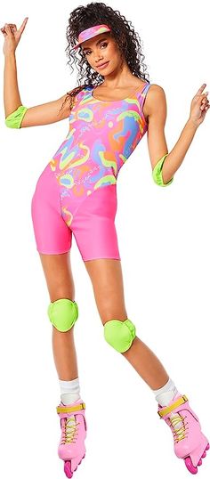 a woman in pink and neon green roller skates with her arms out to the side