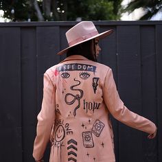 a person wearing a pink jacket and hat