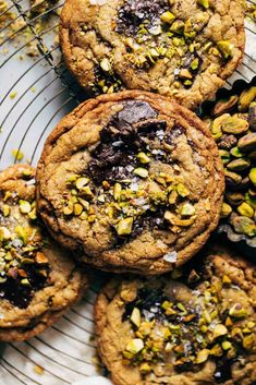 chocolate chip cookies with pistachios on a wire rack