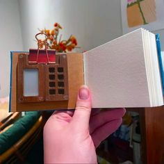 a miniature house made out of an old book