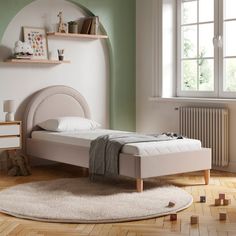 a bedroom with a bed, rug and shelves on the wall in front of it